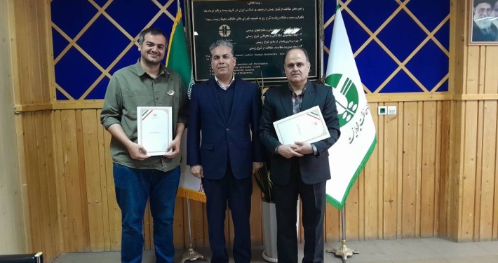 Three signatories standing together after the signing of a memorandum of understanding at Iran’s Department of Environment.