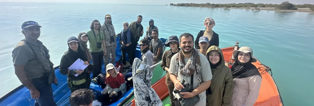 Iman Ebrahimi alongside with his students in a mangrove forest.